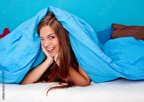 Photo: bedtime 29/girl laughing in bed bedtime 29/girl laughing in bed