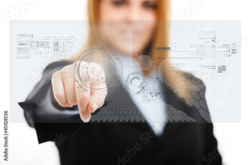 Photo: Woman using a touchscreen Woman using a touchscreen