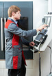 Photo: laborer worker with machining tool center laborer worker with machining tool center