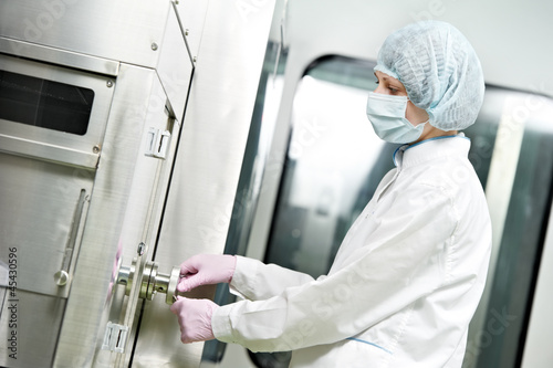 Photo: pharmaceutical factory worker pharmaceutical factory worker