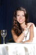 Photo: portrait of young happy beautiful woman in restaurant portrait of young happy beautiful woman in restaurant