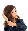 Photo: Little girl brushing her hair Little girl brushing her hair