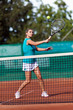 Foto: Young woman playing tennis Young woman playing tennis