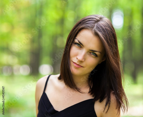 Photo: Beautiful suspicious woman in the forest Beautiful suspicious woman in the forest