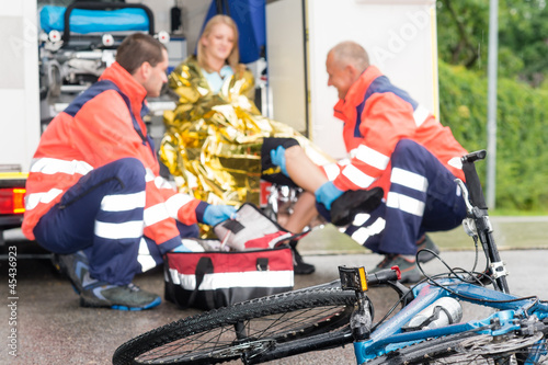 Photo: Accident bike woman get emergency help paramedics Accident bike woman get emergency help paramedics