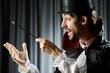 Magician doing tricks on white