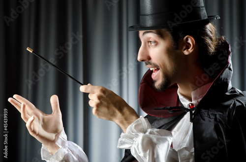 Photo: Magician doing tricks on white Magician doing tricks on white