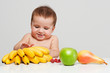 Photo: happy baby with fruits happy baby with fruits