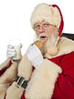 Photo: santa claus drinking milk and eating cookies santa claus drinking milk and eating cookies