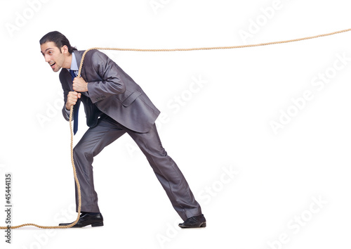 Photo: Businessman pulling rope on white Businessman pulling rope on white