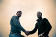 Shaking hand of indian young happy people