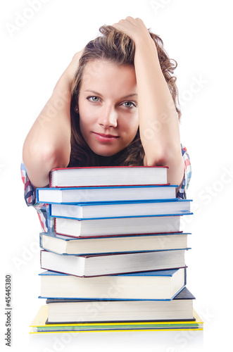 Photo: Student with lots of books on white Student with lots of books on white