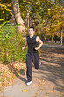Young man running in a beautiful park