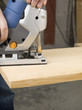 cutting a wood using jigsaw cutter