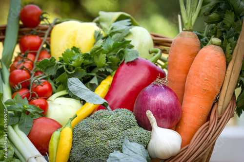 Photo: Fresh organic vegetables in the wicker basket Fresh organic vegetables in the wicker basket