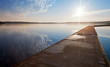 Empty concrete pier in the light of raising sun