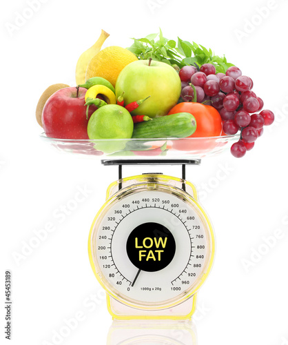 Photo: Low fat concept. Kitchen scale with fruits and vegetables Low fat concept. Kitchen scale with fruits and vegetables