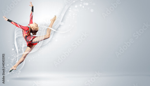 Photo: Young woman in gymnast suit posing Young woman in gymnast suit posing