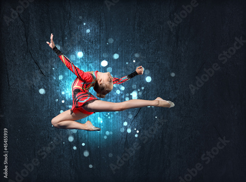 Photo: Young woman in gymnast suit posing Young woman in gymnast suit posing