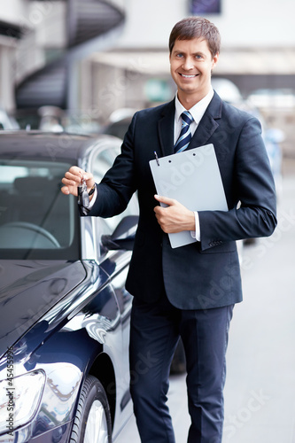 Photo: Seller with car keys Seller with car keys