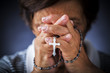 Photo: Praying with a rosary Praying with a rosary