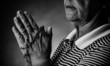 Photo: Praying with a rosary Praying with a rosary