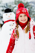 Winter fun, snowman and happy child