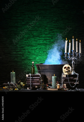 Photo: A Halloween composition of candles, sorcery and a skull A Halloween composition of candles, sorcery and a skull