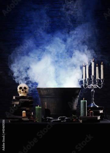 Photo: A Halloween composition of candles, sorcery and a skull A Halloween composition of candles, sorcery and a skull