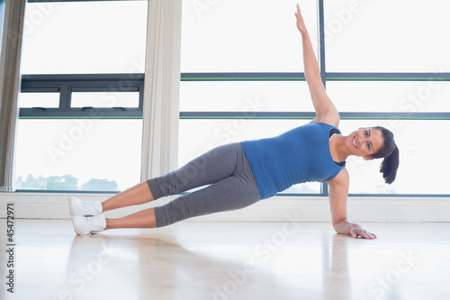 Photo: Happy woman in yoga pose Happy woman in yoga pose