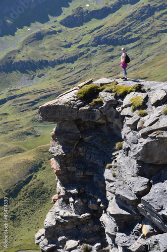 Photo: Traveler on the top of a rock. Switzerland Traveler on the top of a rock. Switzerland