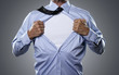 Superhero, young businessman tearing his shirt off