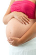 Close up of woman's pregnant tummy.