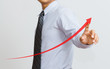 a Business hand pressing a growth chart