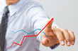 a Business hand pressing a growth chart