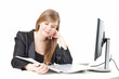 businesswoman working at desk with papers and  computer