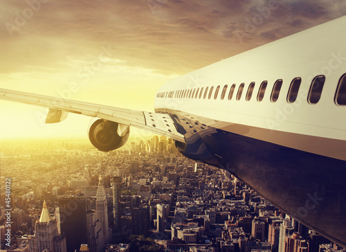 Photo: Airplane over a big City Airplane over a big City