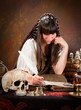 Photo: Witch writing in the book of shadows Witch writing in the book of shadows