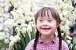 canvas print picture - Portrait of beautiful young girl on flowers background.