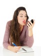Woman pulling face at mobile phone
