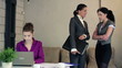Video: Serious businesswomen with looking to camera in the office Serious businesswomen with looking to camera in the office