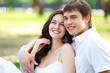 Photo: Young love Couple smiling under blue sky Young love Couple smiling under blue sky