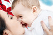 Photo: happy mother kissing baby boy happy mother kissing baby boy
