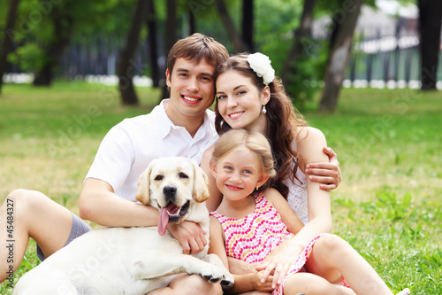 Photo: Happy family having fun outdoors Happy family having fun outdoors
