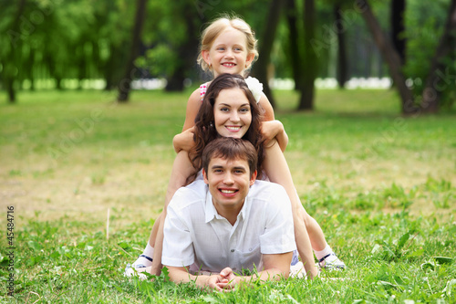 Photo: happy family having fun outdoors happy family having fun outdoors