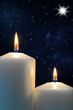 Photo: Two candles with Star of Bethlehem Two candles with Star of Bethlehem