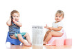 funny children with newspaper and pda on chamberpot