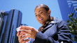 Happy business female using her smart phone