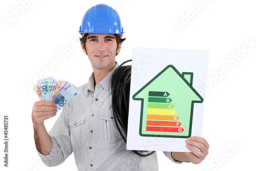 Photo: Man holding energy-rating poster and cash Man holding energy-rating poster and cash