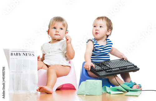 Photo: funny children girl and boy sitting on chamberpot with newspaper funny children girl and boy sitting on chamberpot with newspaper